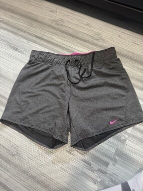 Nike Women's Dark Gray Athletic Shorts with Pink Swoosh